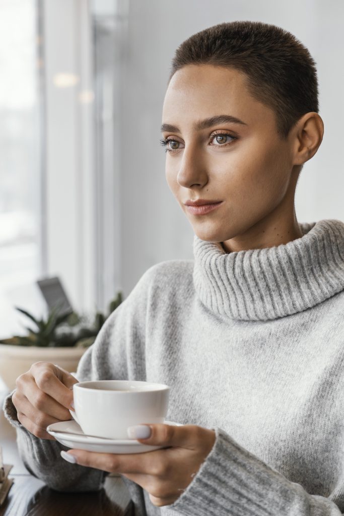 close up woman holding coffee cup